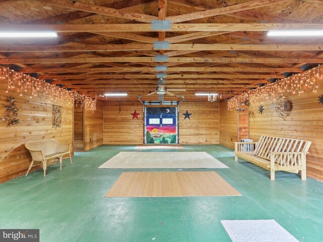 11035 Bennie Duncan Rd, Frederick, MD 21701 - miscellaneous room with wood walls and finished concrete floors