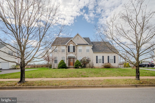 view of front of house featuring stone siding and a front yard