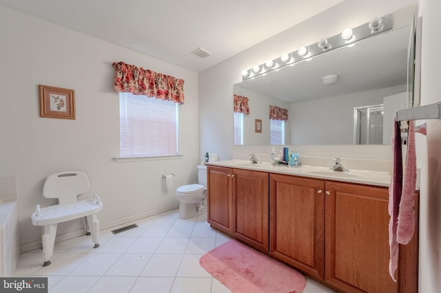 bathroom featuring toilet, visible vents, and a sink