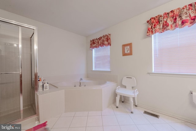bathroom with visible vents, a garden tub, tile patterned flooring, and a shower stall