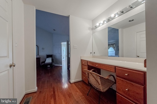 bathroom featuring visible vents, baseboards, and wood finished floors