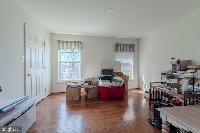 interior space with baseboards and hardwood / wood-style floors