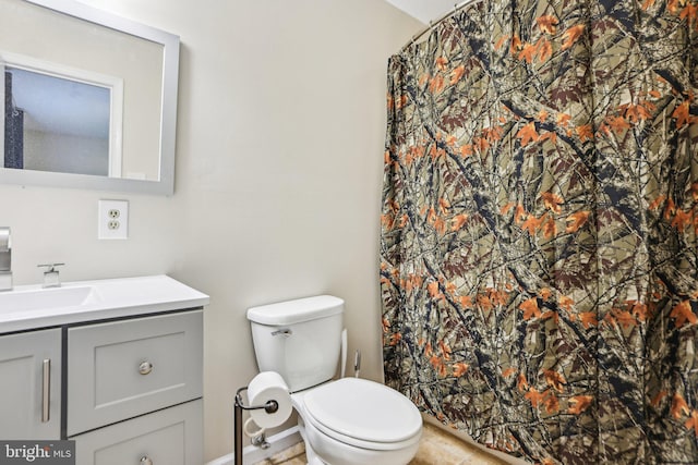 full bath with tile patterned floors, vanity, curtained shower, and toilet