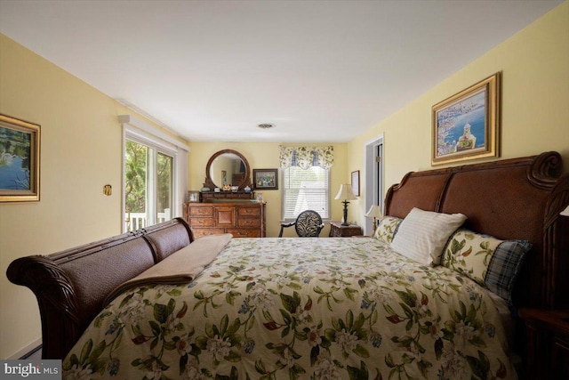 bedroom featuring access to outside and multiple windows