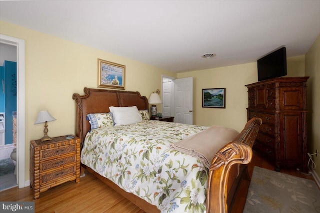 bedroom with wood finished floors