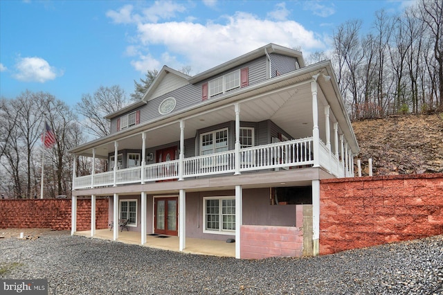 back of property featuring french doors and a patio