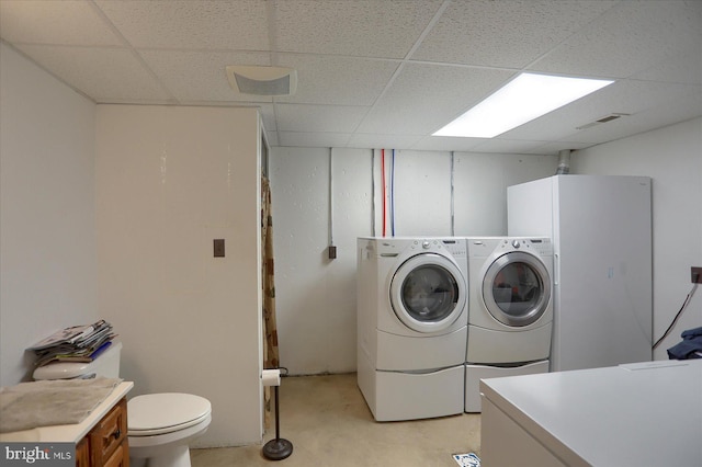 laundry area with washing machine and dryer