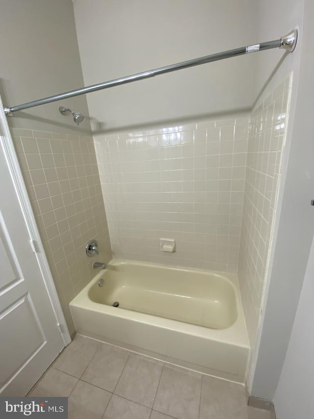 full bathroom featuring tile patterned floors and  shower combination