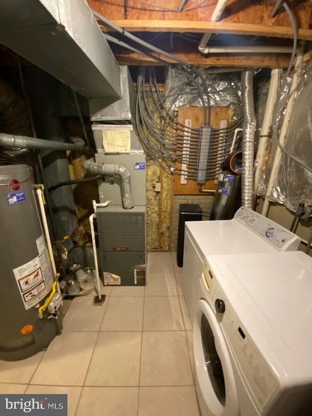 laundry room with gas water heater, separate washer and dryer, light tile patterned flooring, and heating unit