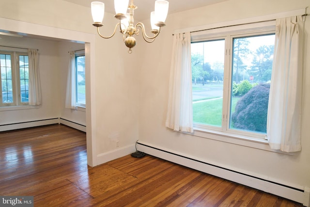 20 Leuckel Ave, Hamilton, NJ 08619 - unfurnished dining area featuring a baseboard heating unit, healthy amount of natural light, dark wood-type flooring, and a chandelier