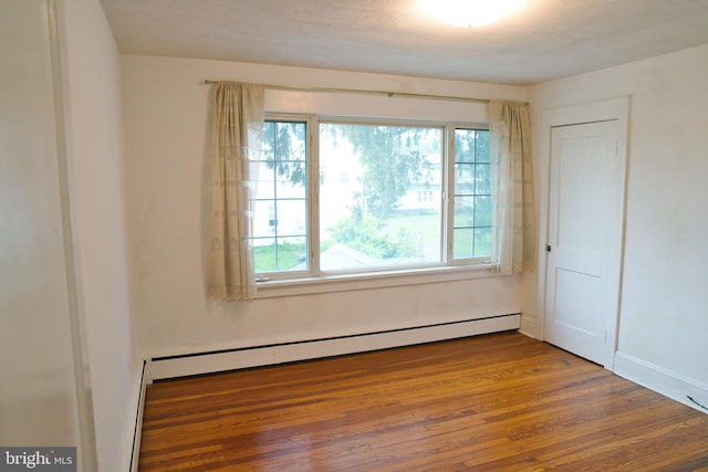 20 Leuckel Ave, Hamilton, NJ 08619 - spare room featuring baseboard heating, wood finished floors, and baseboards