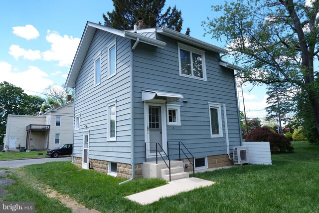 20 Leuckel Ave, Hamilton, NJ 08619 - view of front of home with ac unit, a front yard, and a chimney