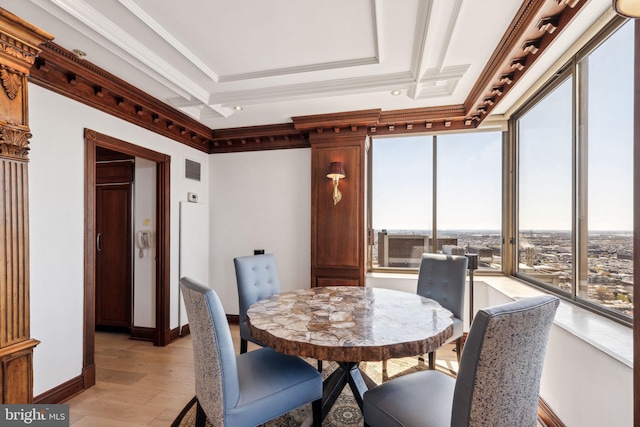 dining space featuring light wood-type flooring, baseboards, ornamental molding, and visible vents