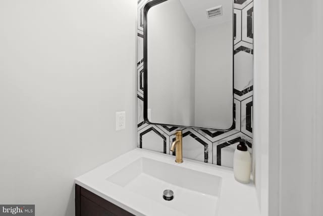 bathroom with vanity and backsplash