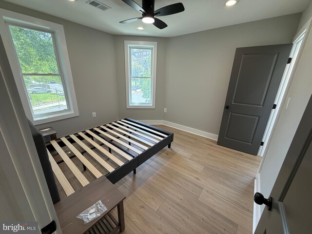 unfurnished bedroom featuring light wood-style flooring, recessed lighting, and baseboards