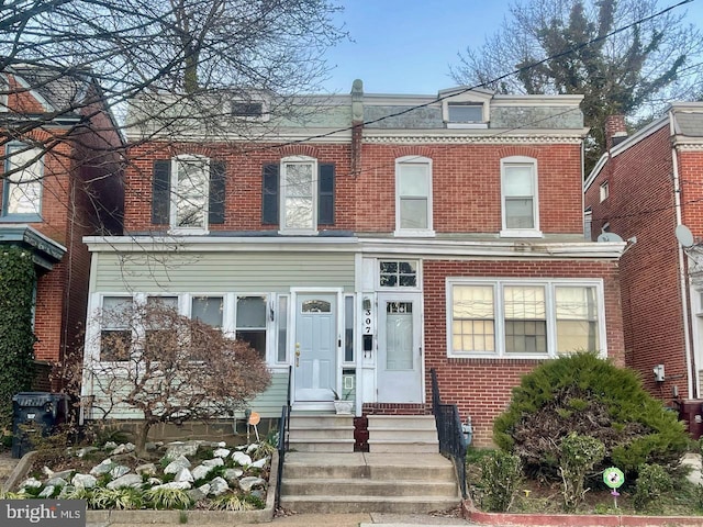 view of front of house featuring brick siding
