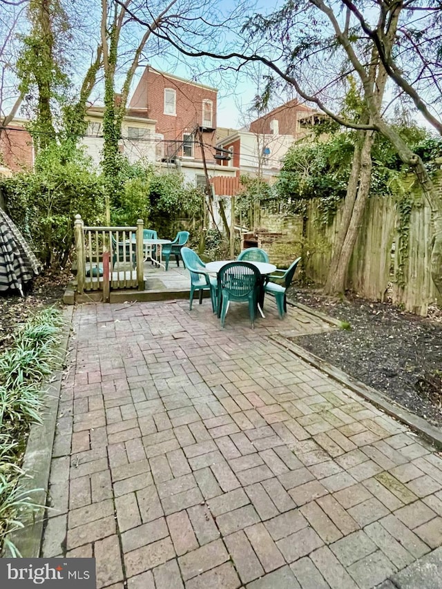 view of patio / terrace featuring fence