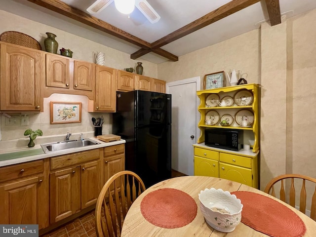 kitchen with open shelves, light countertops, a sink, and black appliances