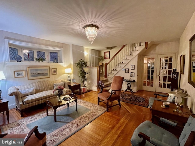 living room featuring french doors and stairs