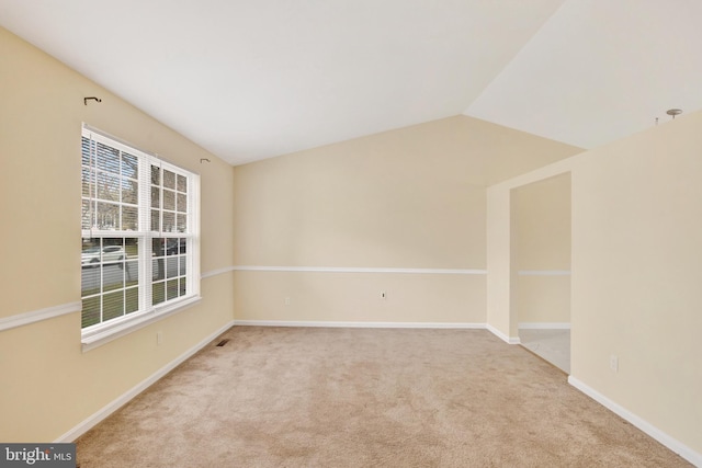 6135 Rainbow Dr, Elkridge, MD 21075 - empty room featuring baseboards, vaulted ceiling, and carpet
