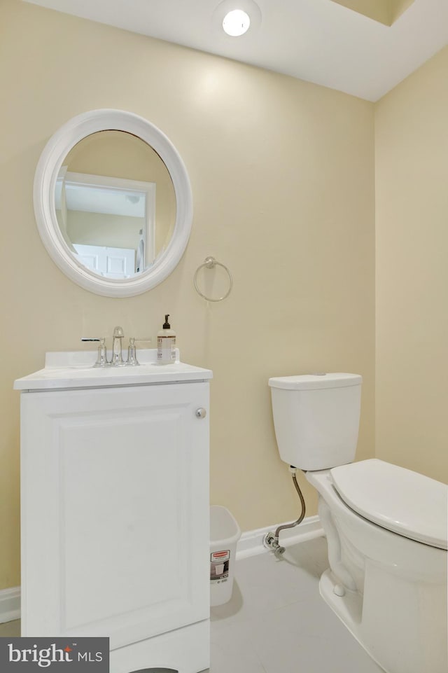 6135 Rainbow Dr, Elkridge, MD 21075 - half bath with tile patterned floors, vanity, baseboards, and toilet