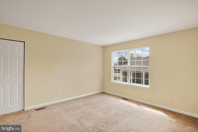 6135 Rainbow Dr, Elkridge, MD 21075 - carpeted spare room with visible vents and baseboards