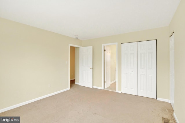 6135 Rainbow Dr, Elkridge, MD 21075 - unfurnished bedroom featuring visible vents, baseboards, and carpet flooring