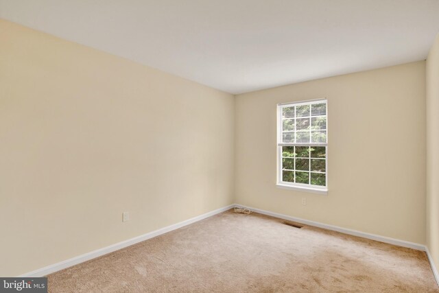 6135 Rainbow Dr, Elkridge, MD 21075 - spare room with carpet flooring, visible vents, and baseboards