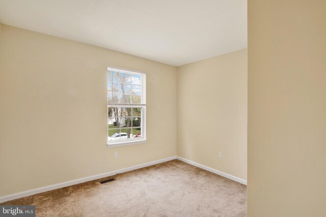 6135 Rainbow Dr, Elkridge, MD 21075 - spare room with baseboards, carpet, and visible vents