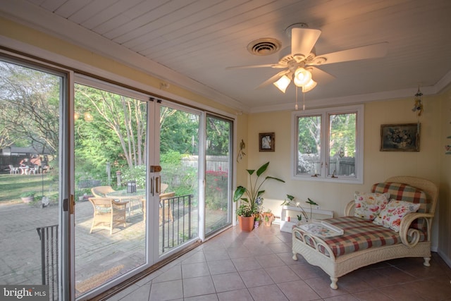 sunroom / solarium featuring visible vents and a wealth of natural light
