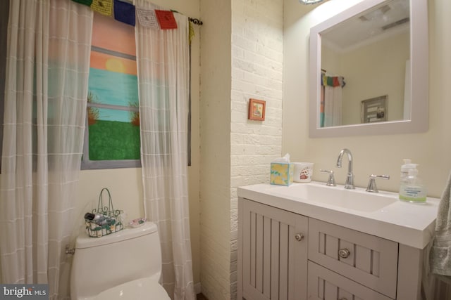 bathroom featuring toilet and vanity