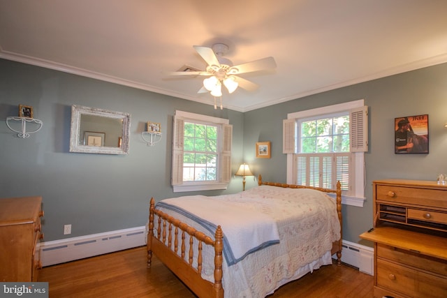 bedroom with a baseboard radiator, ornamental molding, a ceiling fan, and wood finished floors