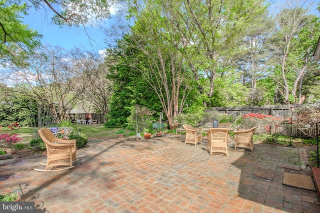 view of patio / terrace with outdoor dining area and fence