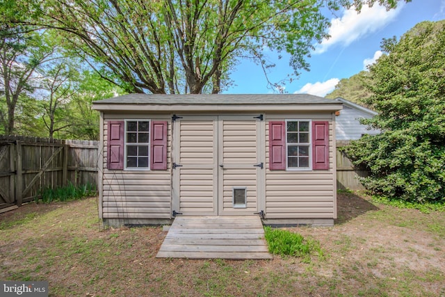 view of shed featuring a fenced backyard