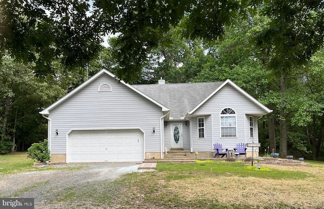7270 Mackall Rd, Saint Leonard, MD 20685 - ranch-style home featuring an attached garage, driveway, a front lawn, and view of wooded area