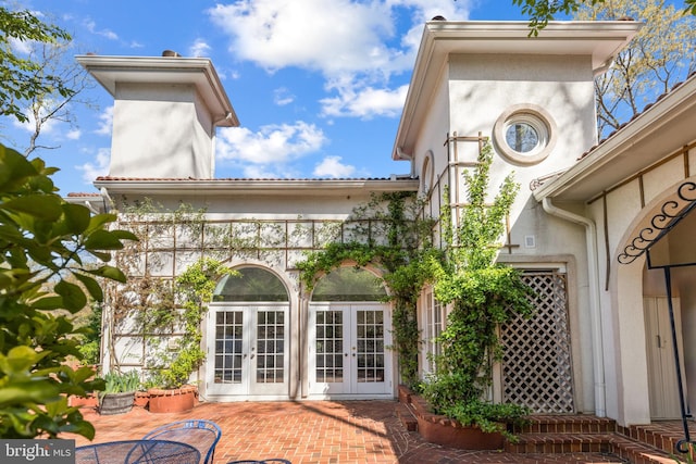 1405 N Pegram St, Alexandria, VA 22304 - rear view of house featuring french doors, stucco siding, and a patio area