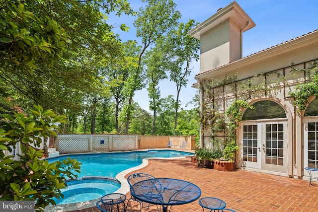 1405 N Pegram St, Alexandria, VA 22304 - view of swimming pool with french doors, a fenced backyard, a pool with connected hot tub, and a patio area