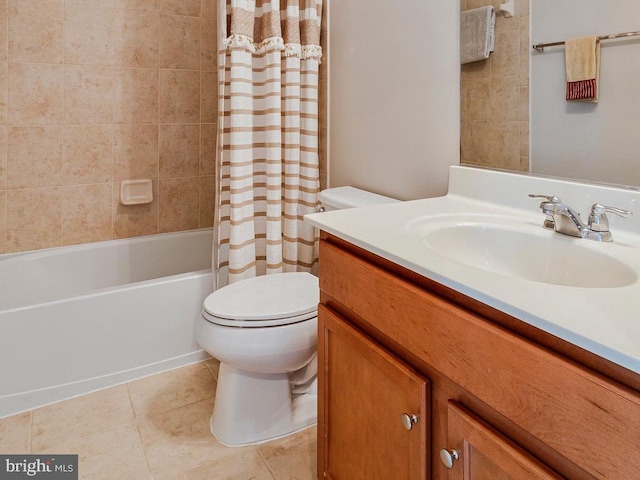 bathroom with vanity, tile patterned flooring, shower / bath combo with shower curtain, and toilet