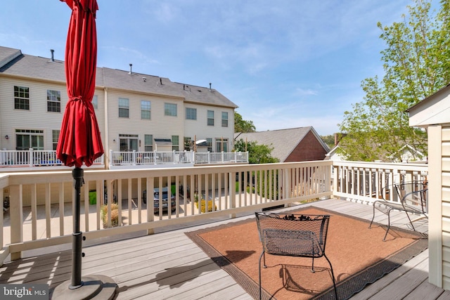 wooden deck featuring a residential view
