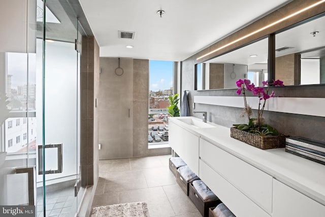 1515 15th St NW Unit 422, Washington, DC 20005 - bathroom featuring vanity, visible vents, tile patterned flooring, and floor to ceiling windows