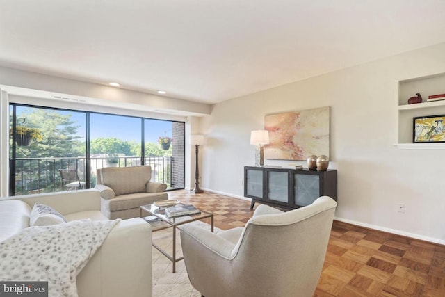 living room with built in features, baseboards, and recessed lighting