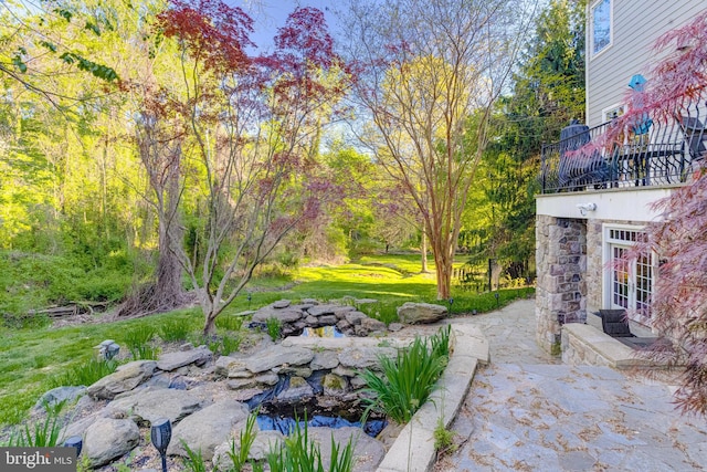 1100 Washingtonville Dr, Baltimore, MD 21210 - view of yard with french doors, a balcony, and a patio area