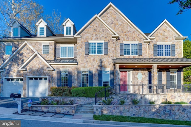 1100 Washingtonville Dr, Baltimore, MD 21210 - view of front of home with a standing seam roof, stone siding, and a garage