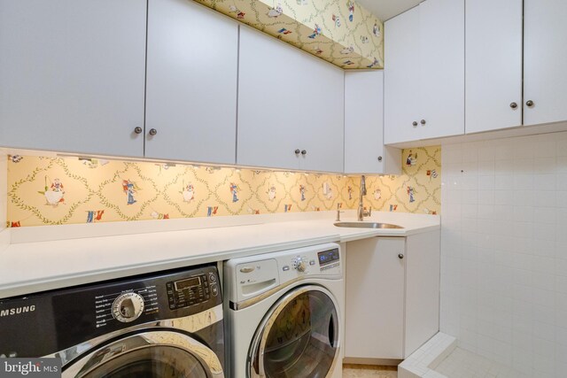 1100 Washingtonville Dr, Baltimore, MD 21210 - laundry room featuring a sink, washing machine and dryer, and cabinet space