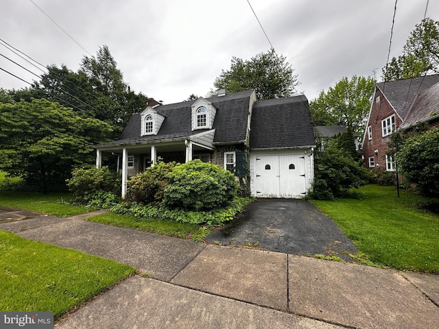104 Amherst Ave, Reading, PA 19609 - view of front facade featuring a front lawn, driveway, an attached garage, and a chimney