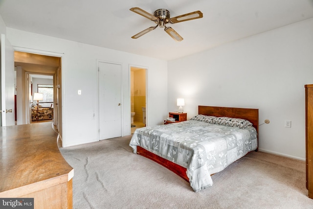 9 Dennison Dr, East Windsor, NJ 08520 - carpeted bedroom with ensuite bath, baseboards, and ceiling fan