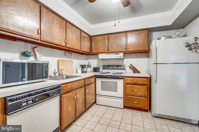 9 Dennison Dr, East Windsor, NJ 08520 - kitchen featuring brown cabinets, under cabinet range hood, a sink, and white appliances