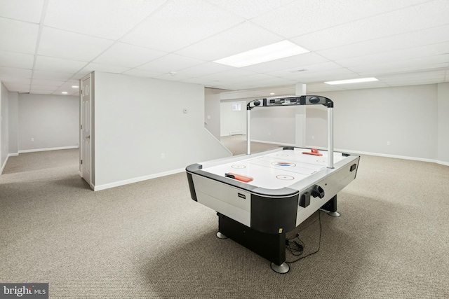 game room featuring carpet, baseboards, and a drop ceiling