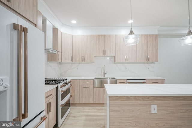 1143 Tasker St, Philadelphia, PA 19148 - kitchen with light brown cabinetry, modern cabinets, a sink, white appliances, and pendant lighting