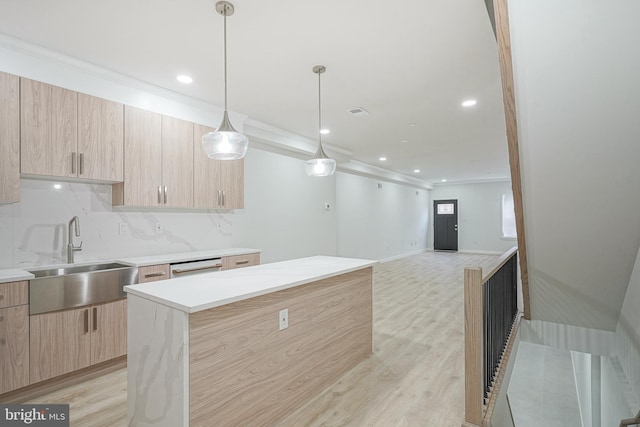 1143 Tasker St, Philadelphia, PA 19148 - kitchen with modern cabinets, light brown cabinetry, a sink, and crown molding
